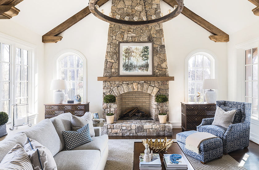 Rustic architectural details in the family room inspired Penno’s earth-toned palette throughout.