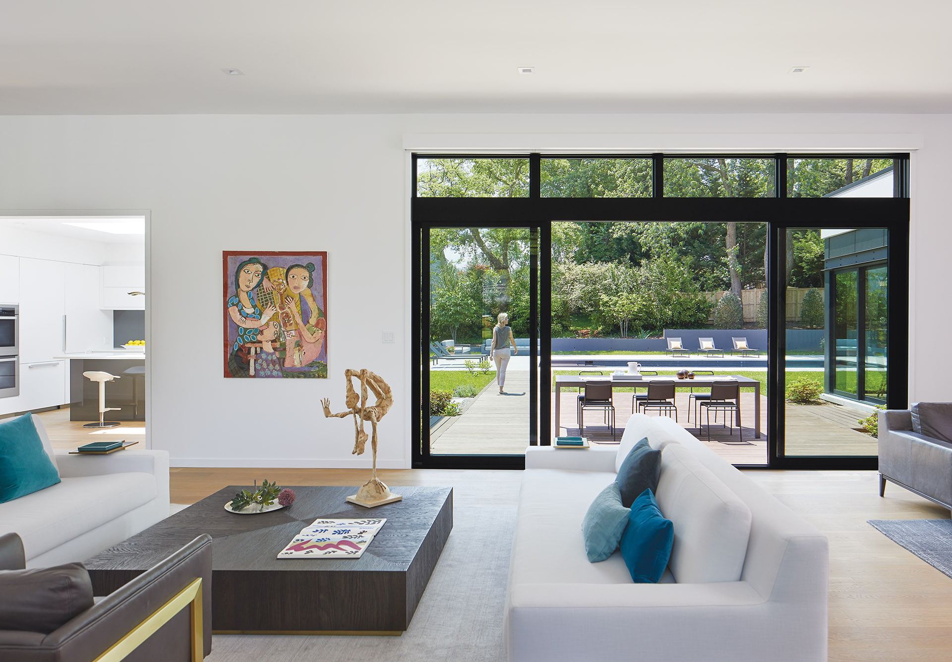 Living area boasts multi-slide doors from Loewen with a 16-foot opening