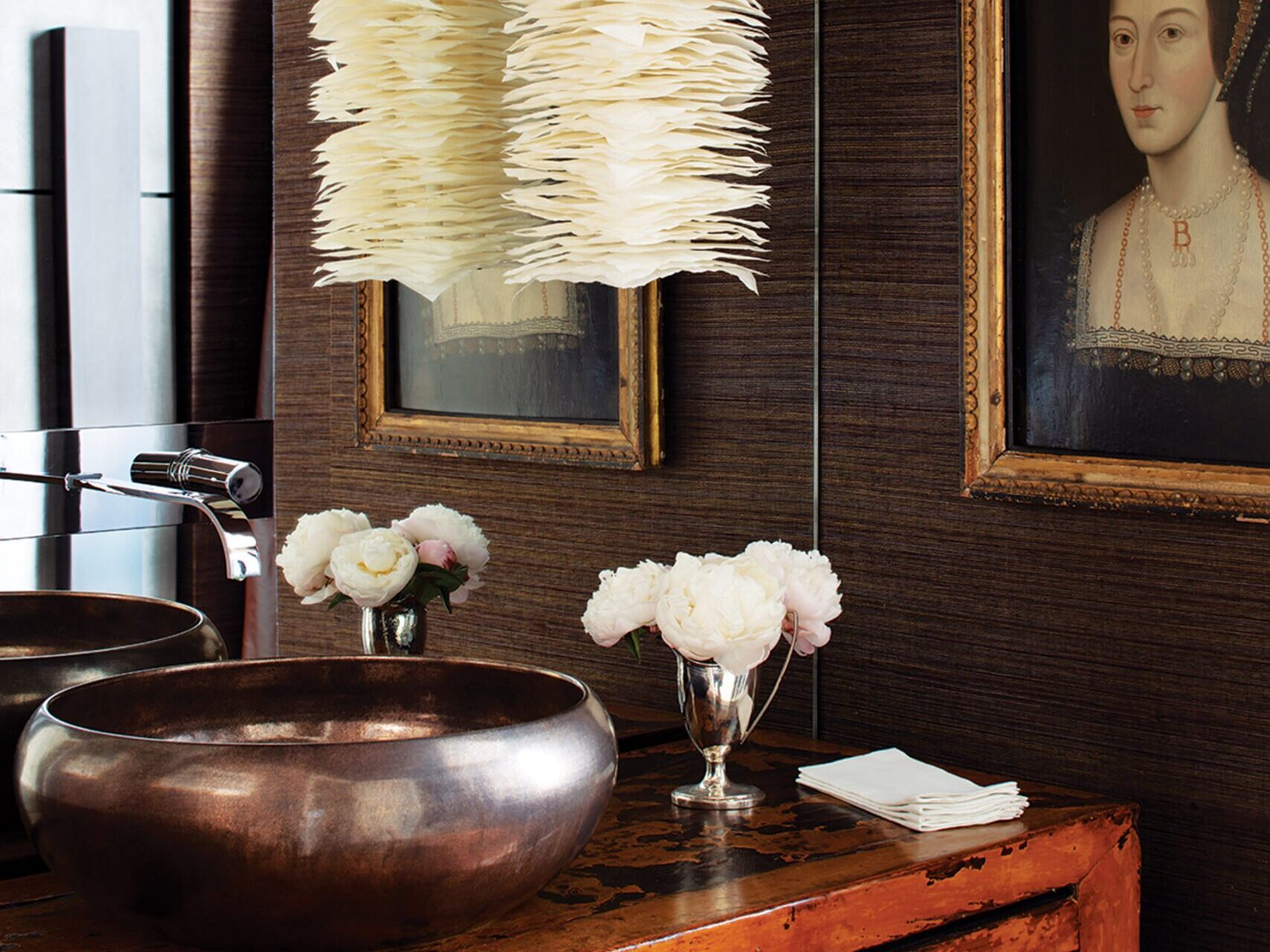 Powder room contemporary sconce and vintage Chinese cabinet that doubles as a vanity.